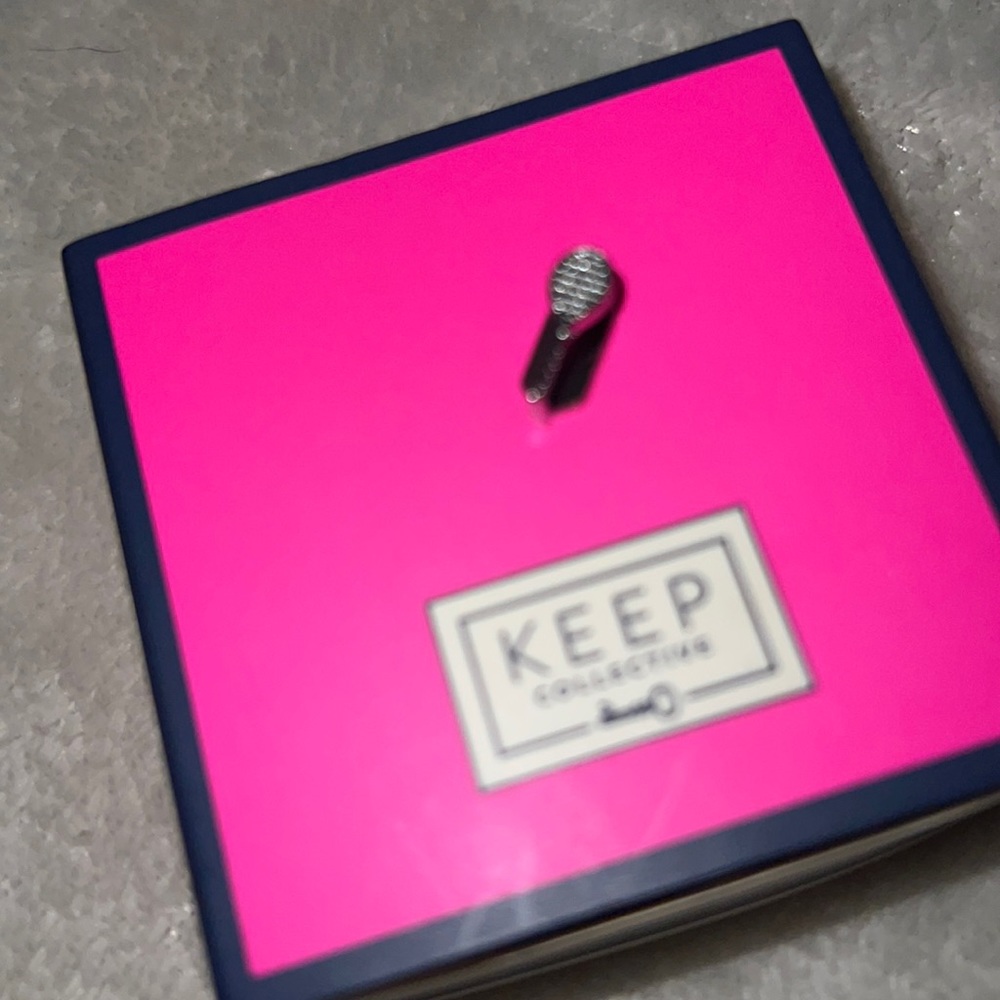 Keep collective tennis racket charm